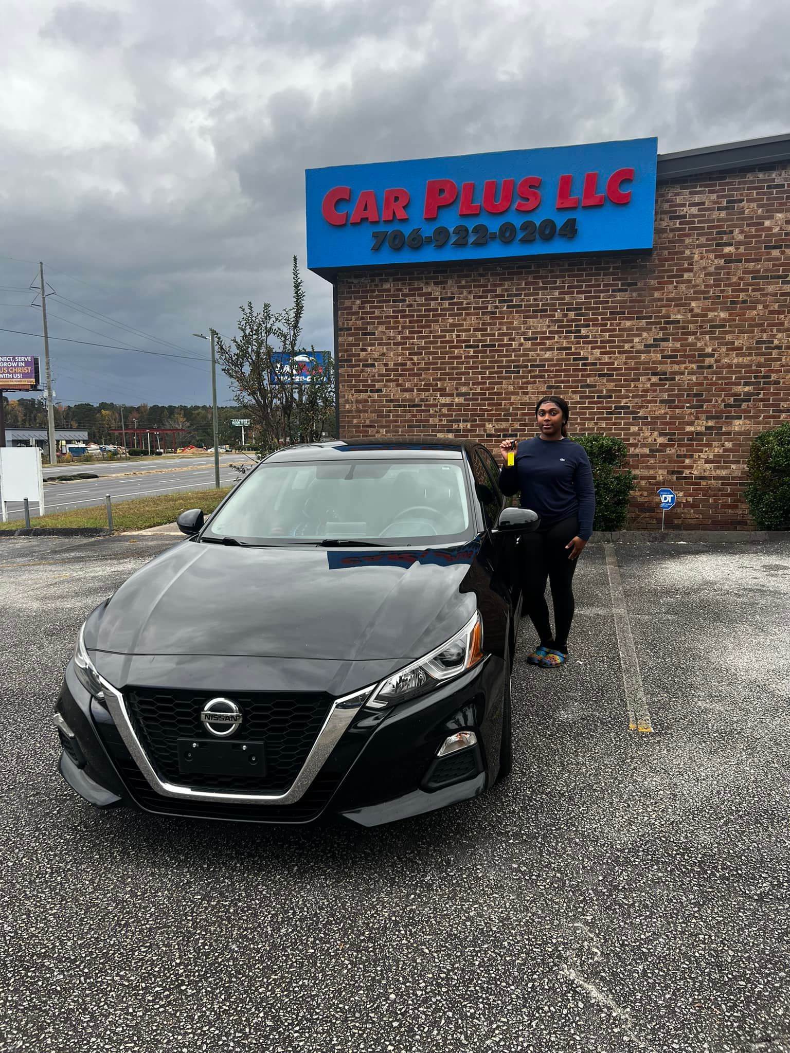 Woman With Nissan Car — Augusta, GA — Car Plus LLC