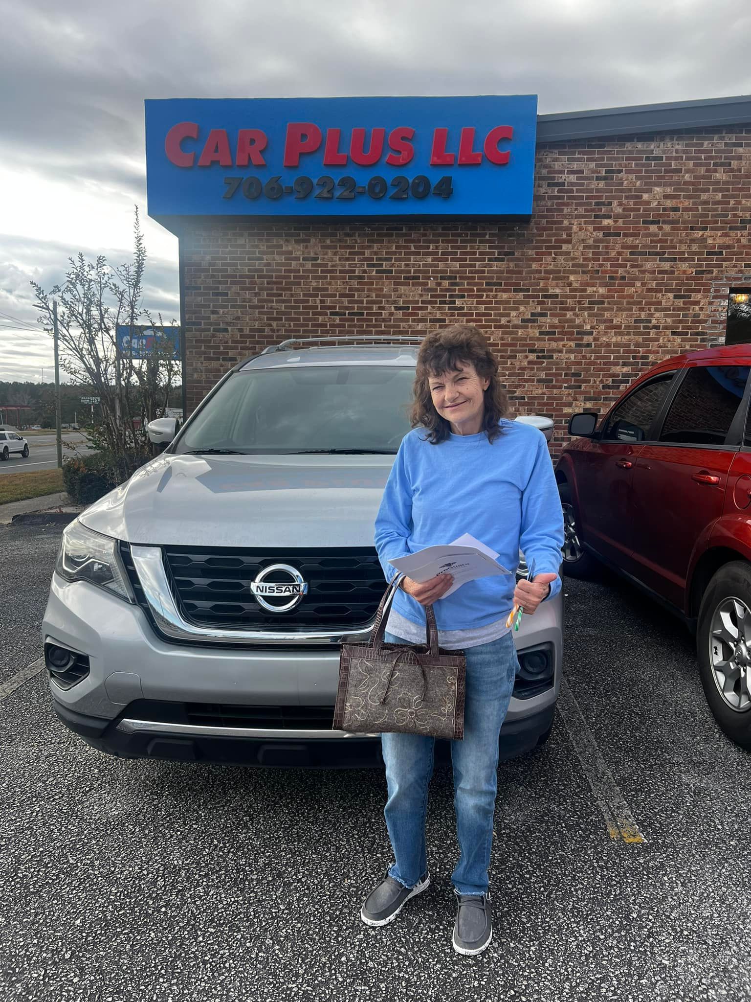 Woman With Gray Nissan Car — Augusta, GA — Car Plus LLC