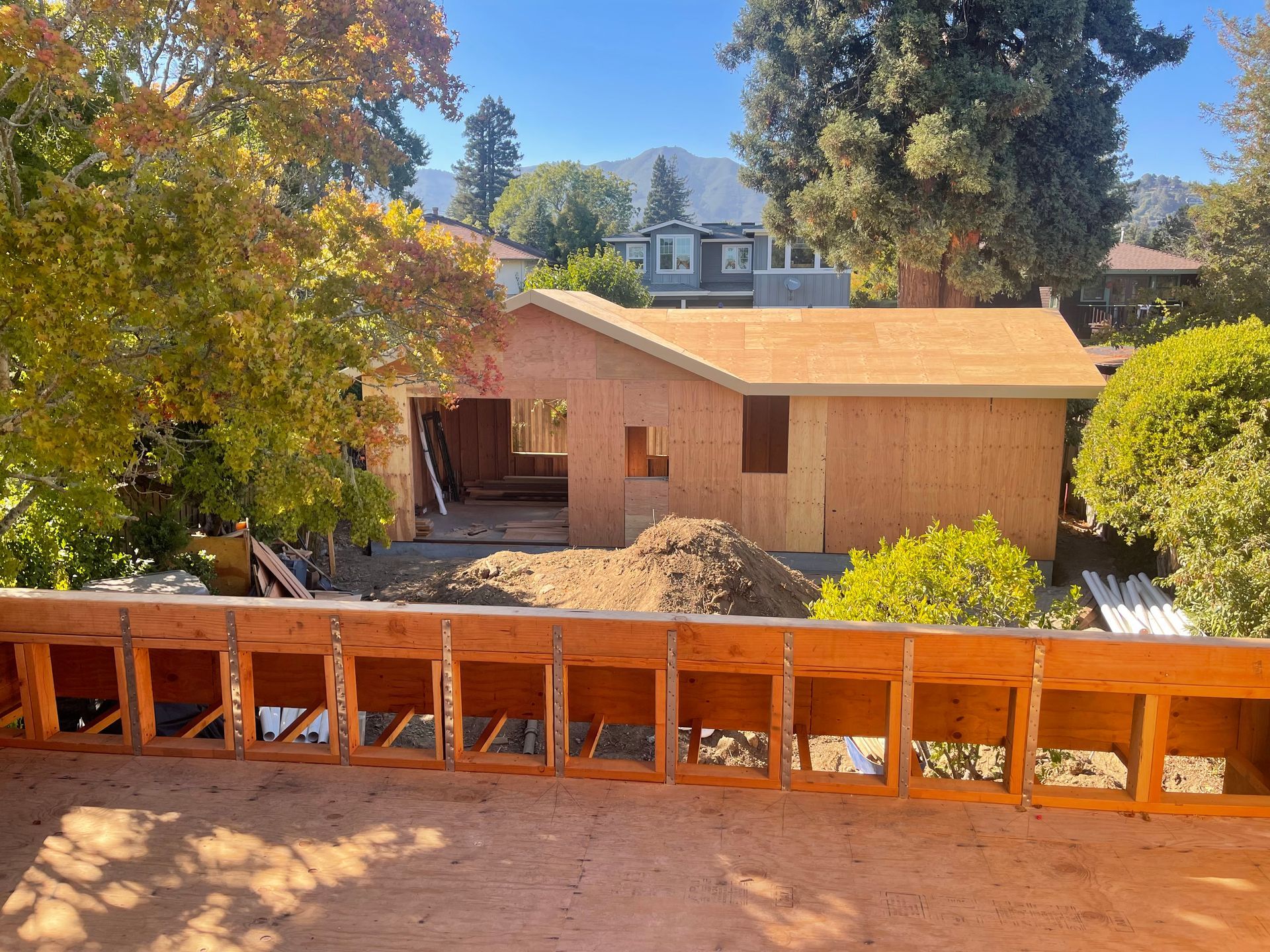 A view of a house under construction from a balcony.