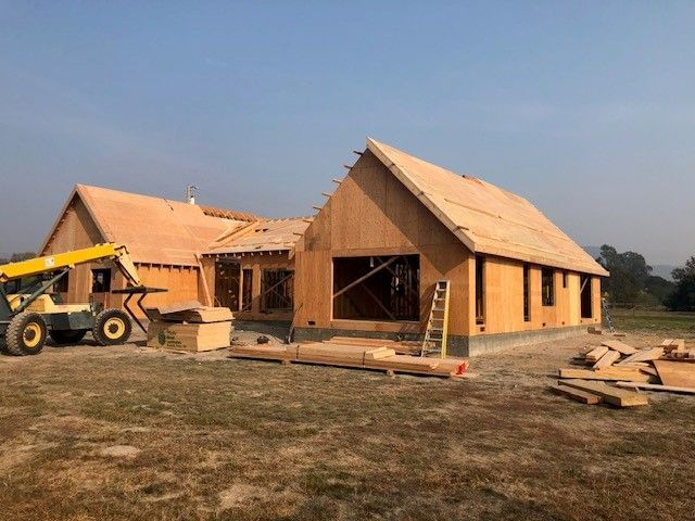 There is a lot of wood on the ground under the deck.