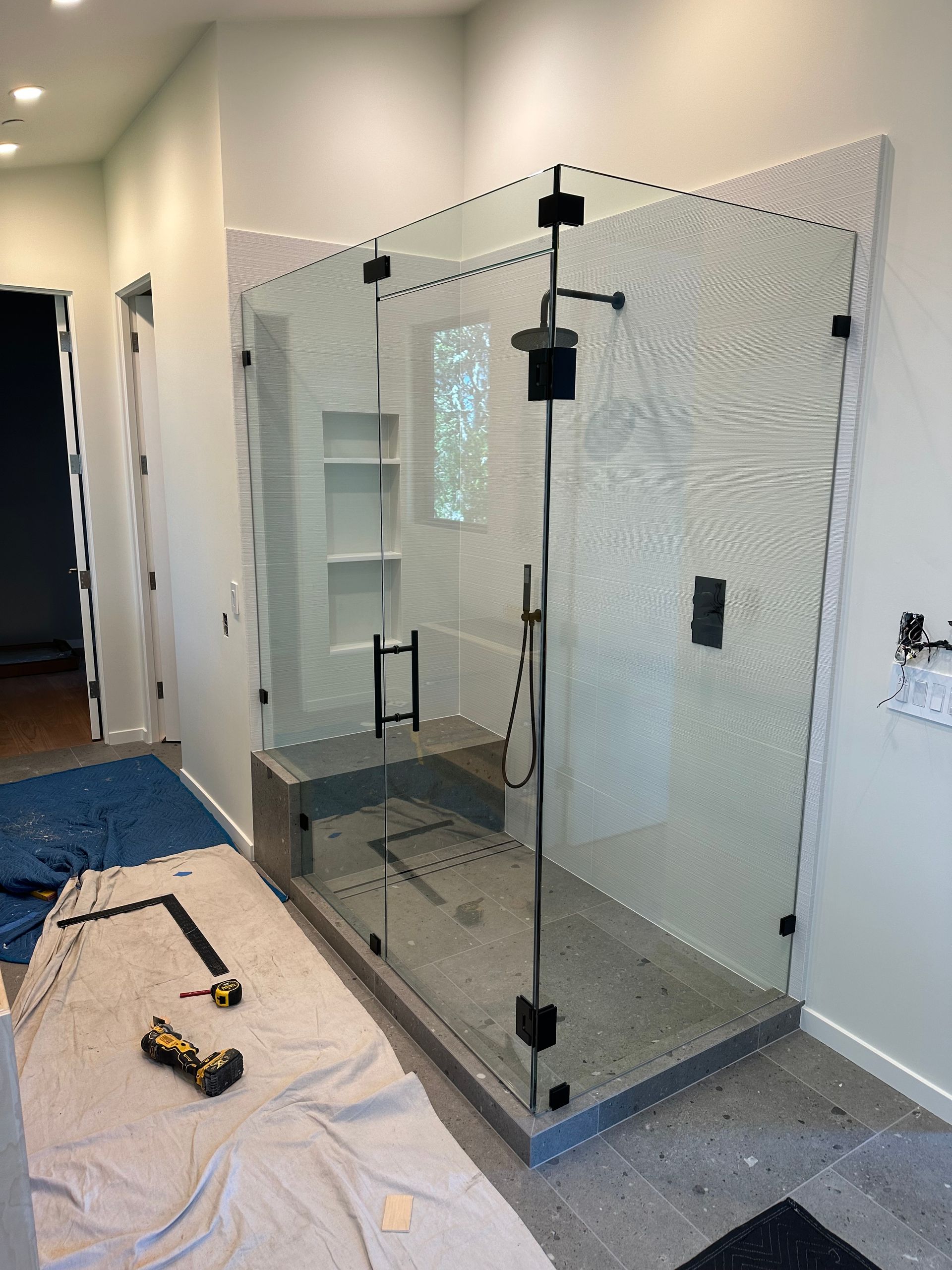 A bathroom with a sink , toilet , tub and mirror.