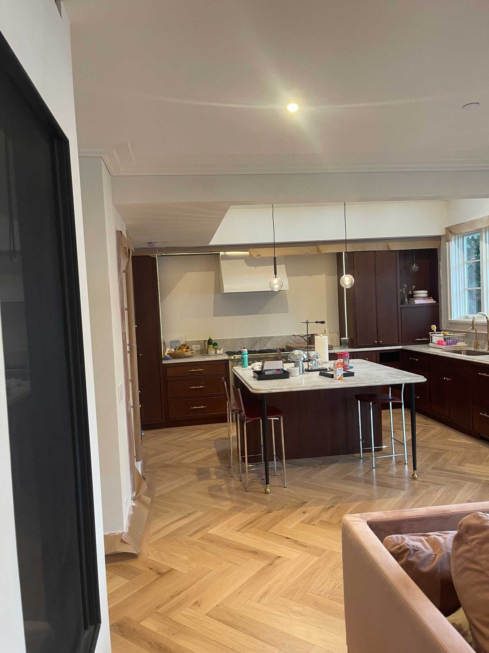 A kitchen with a large island in the middle of the room.