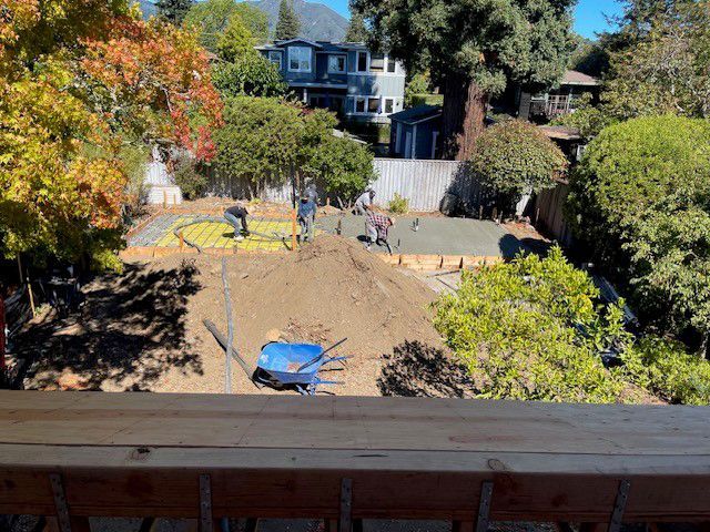 A view of a construction site from a deck.