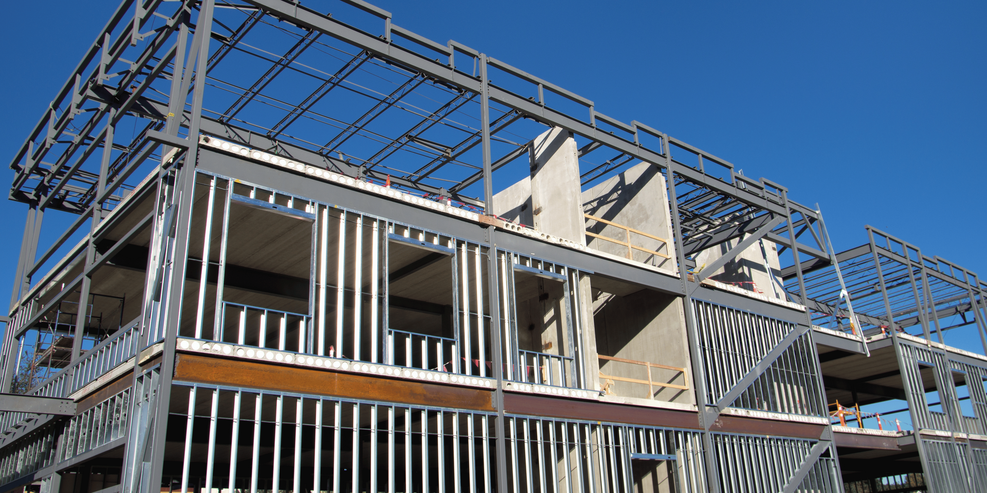 A brick wall with a bunch of electrical boxes on it