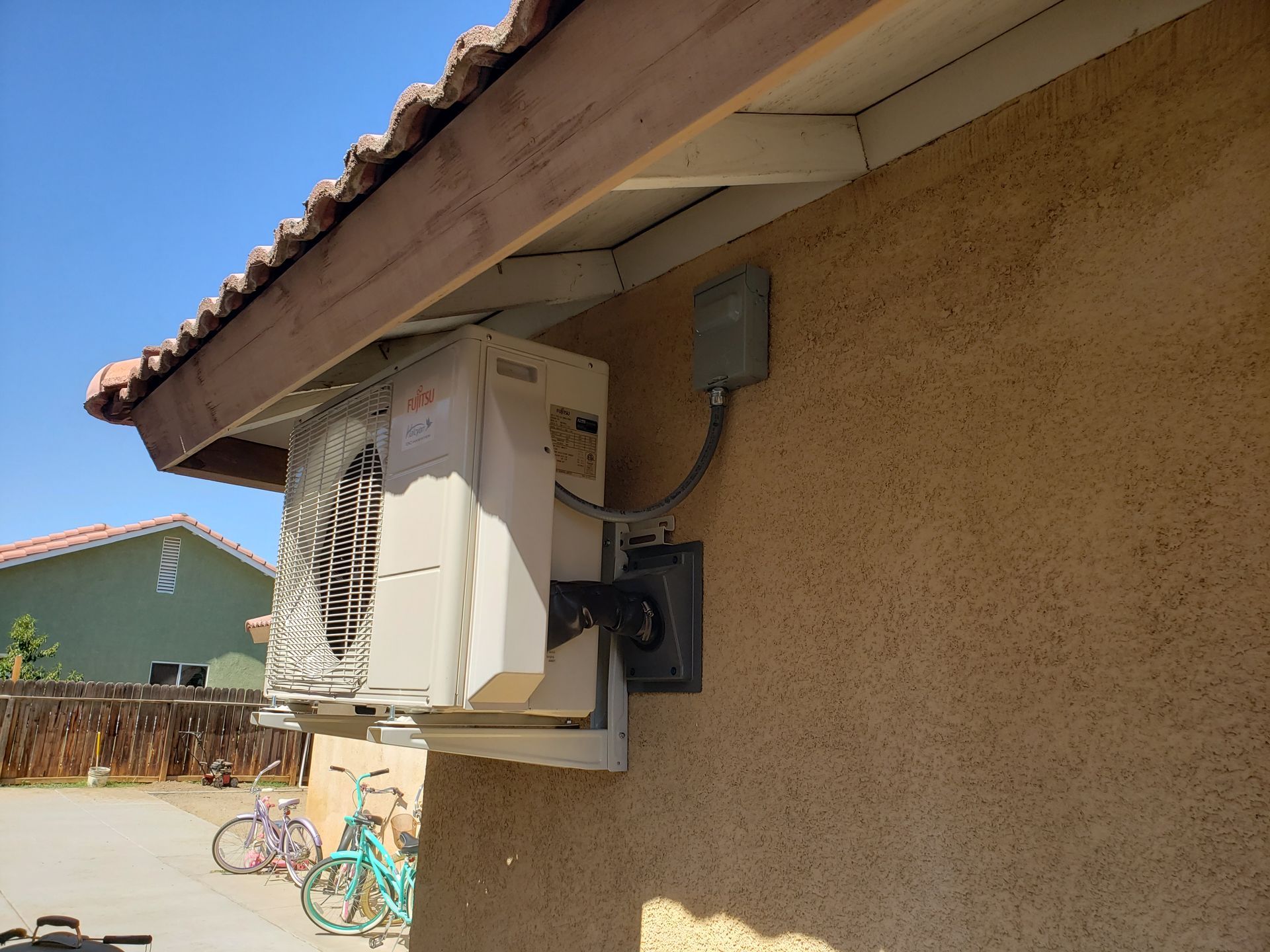 an air conditioner is mounted on the side of a building