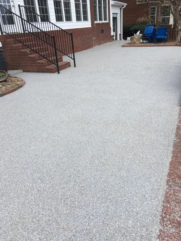 Worker Using Epoxy on Floor