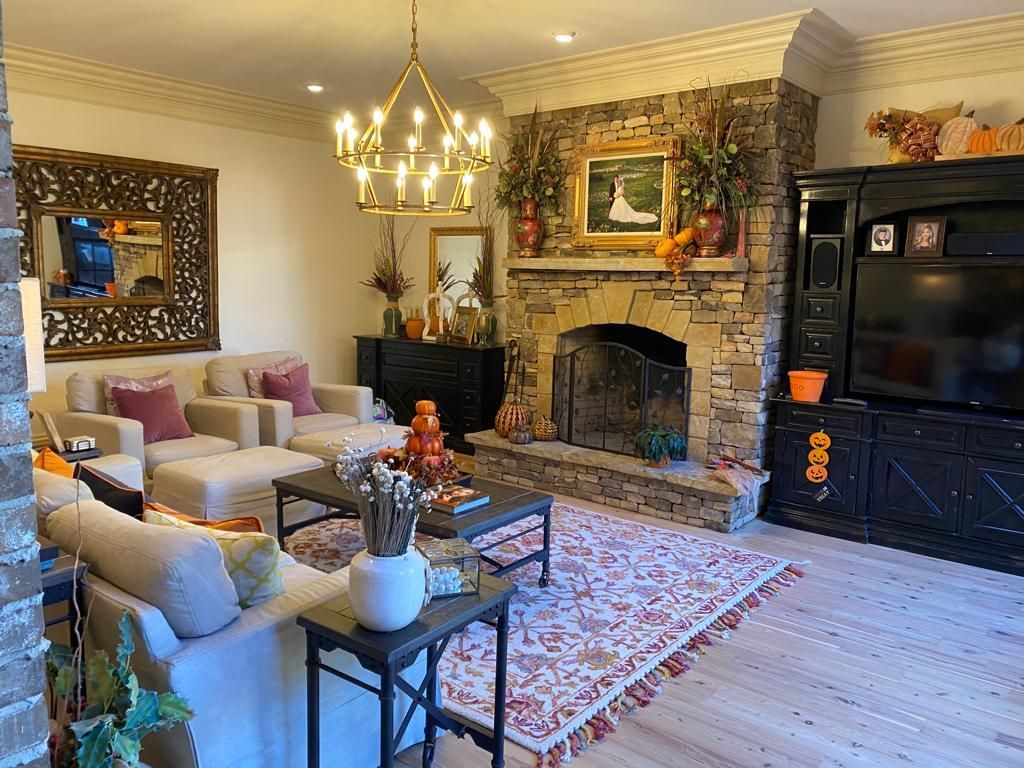 A living room filled with furniture and a fireplace.