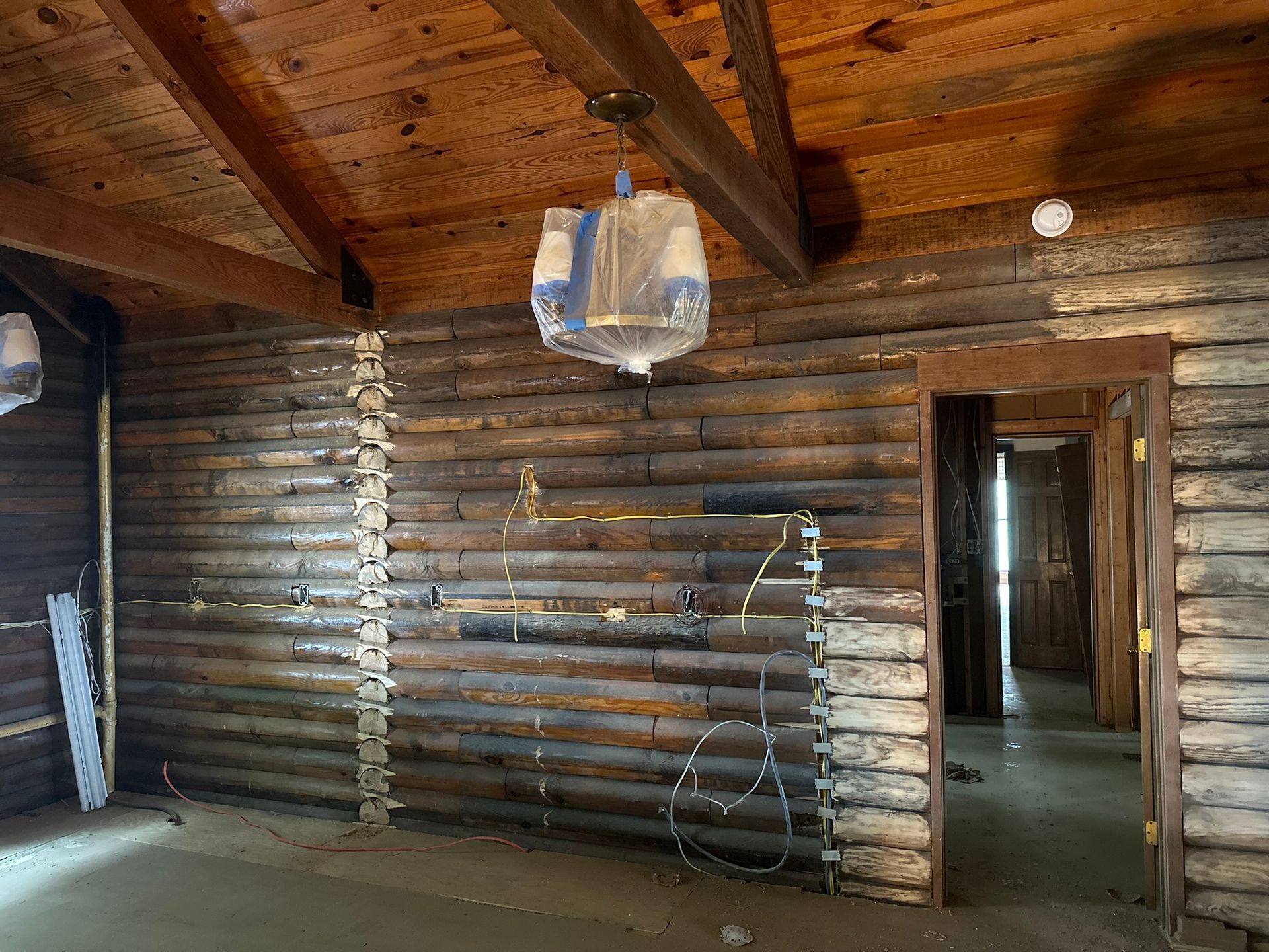 An empty room with a wooden wall and ceiling