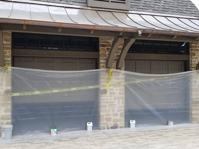 Two Garage Doors Covered with Plastic