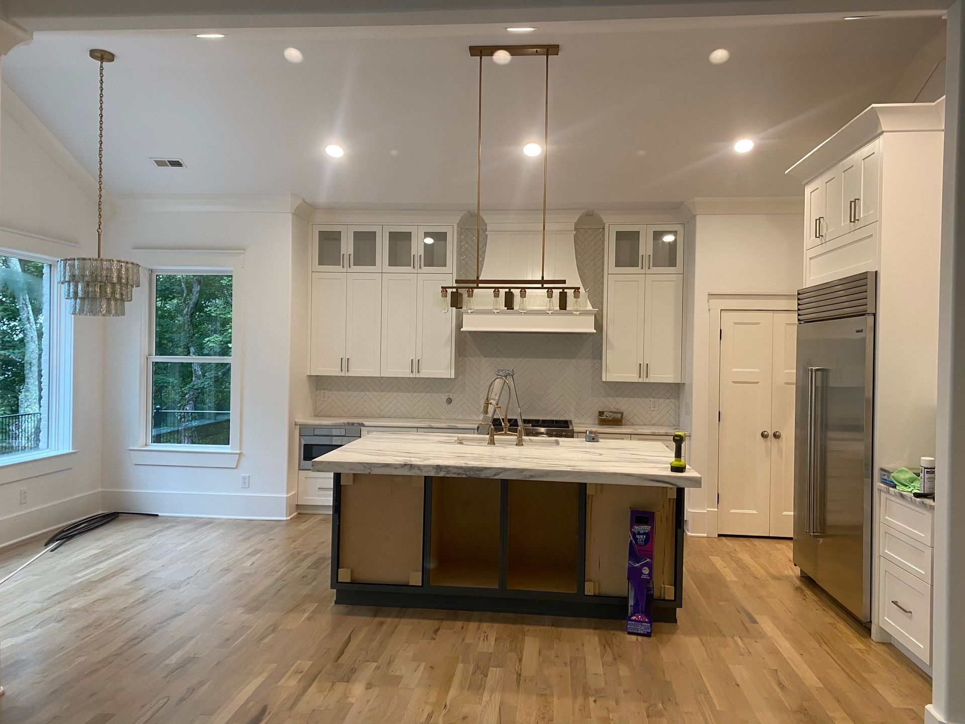 A kitchen with a large island in the middle of the room.
