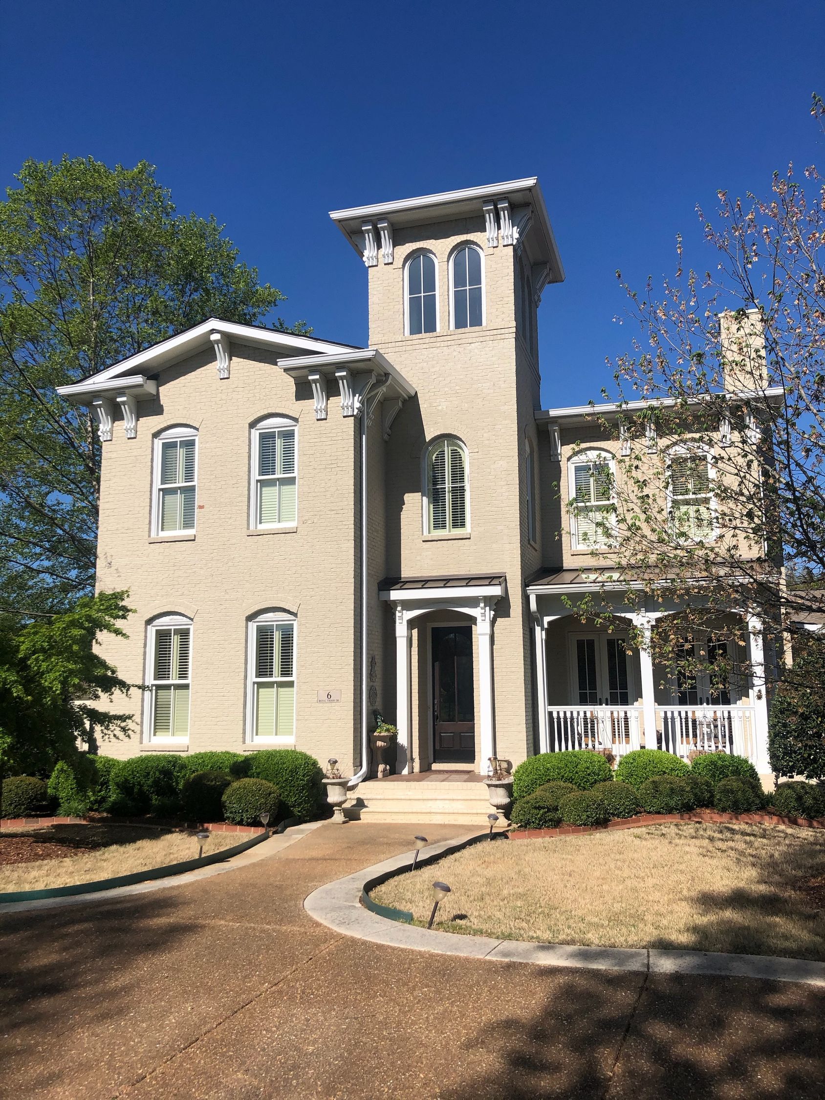 A large house with a tower on top of it.