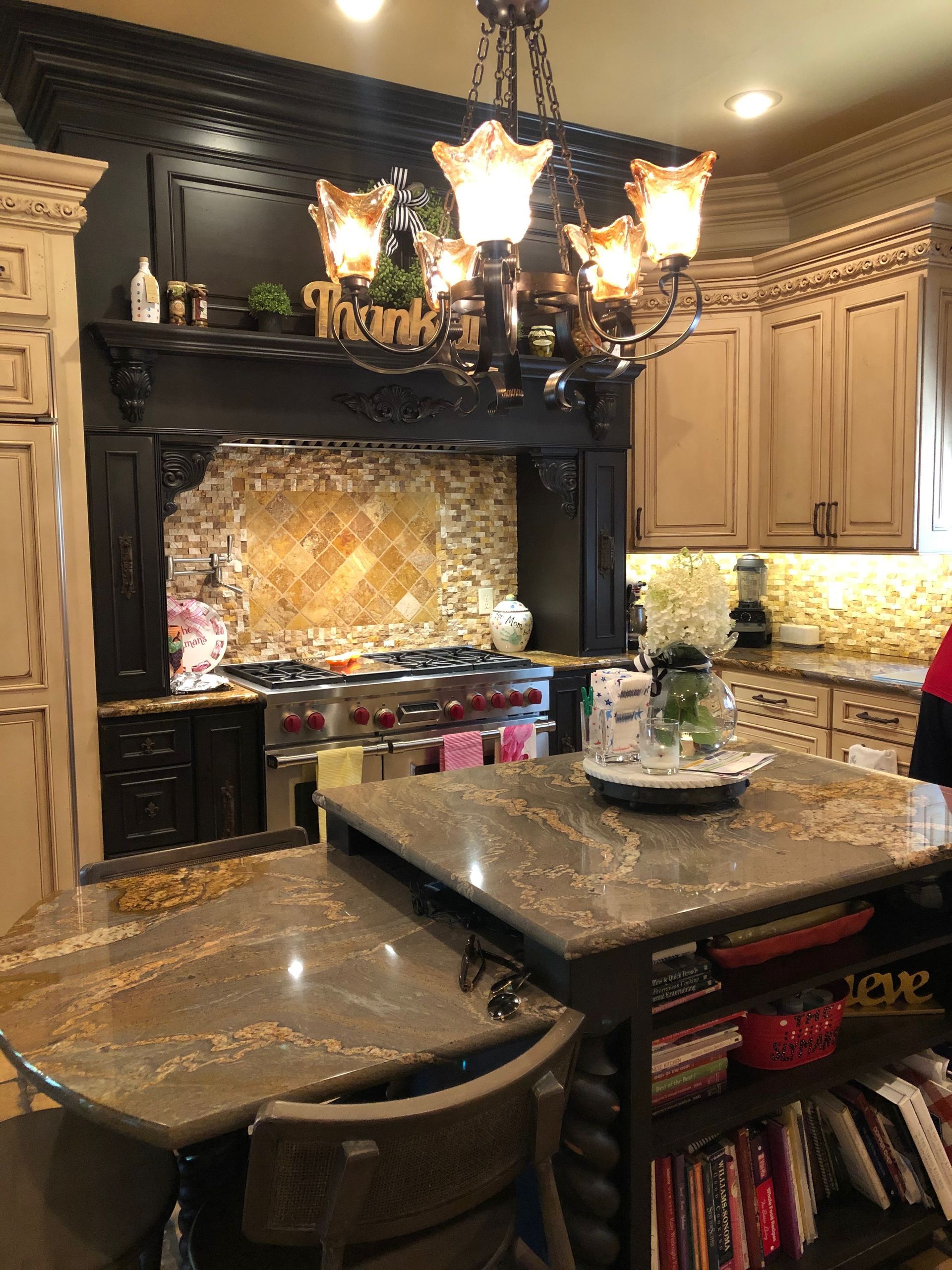 A kitchen with a large island and a sign that says thank you