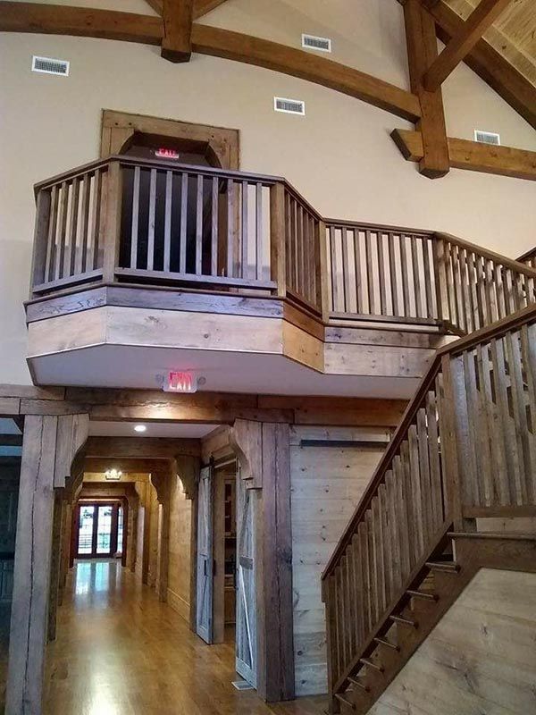 Hallway with a Balcony and Stairs