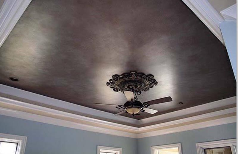 Ceiling Fan Hanging from a Brown Ceiling