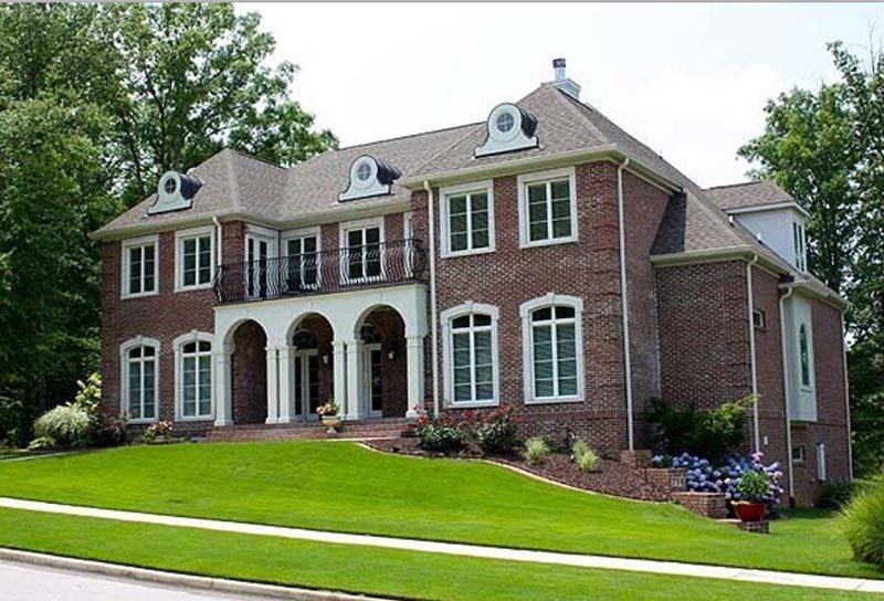 Brick House sits on a Lush Green Hillside