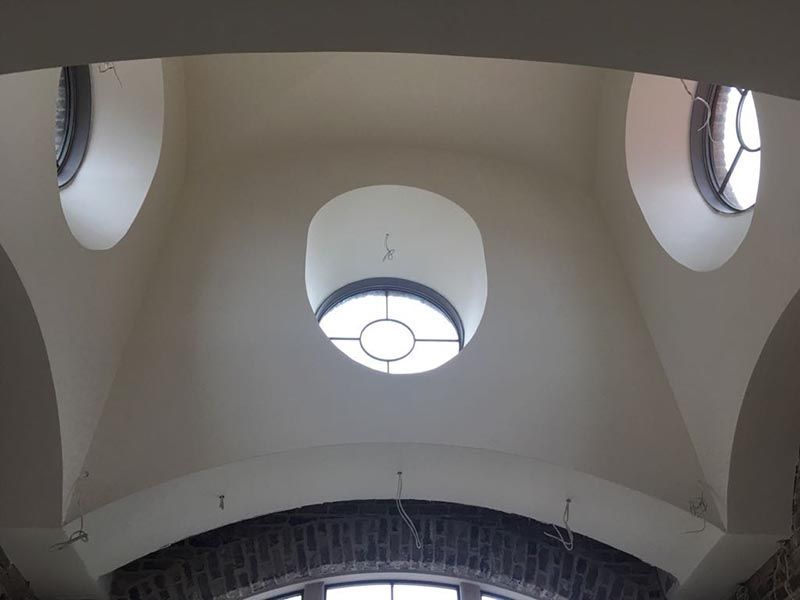 Ceiling of a Building with Round a Window