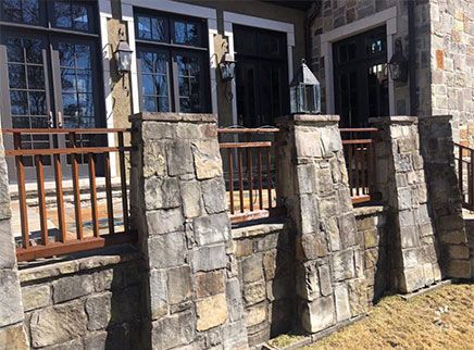 Stone Wall with a Metal Railing