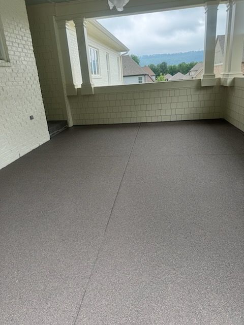 An empty room with a ceiling fan and a view of a house