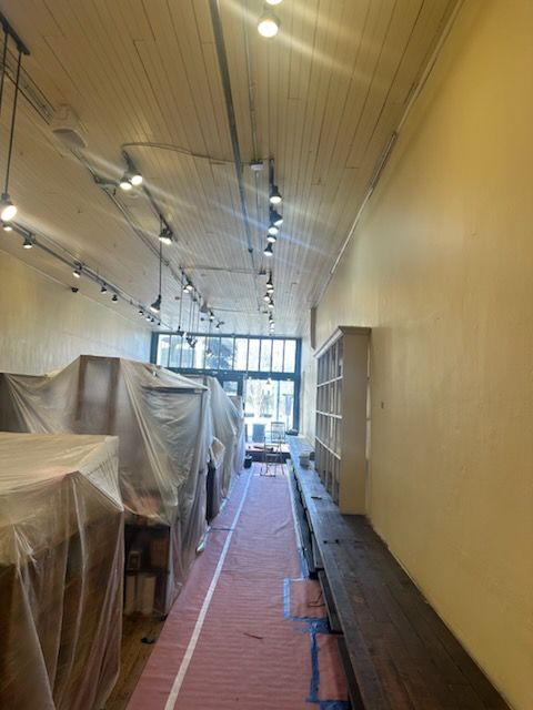 A long hallway in a building that is under construction