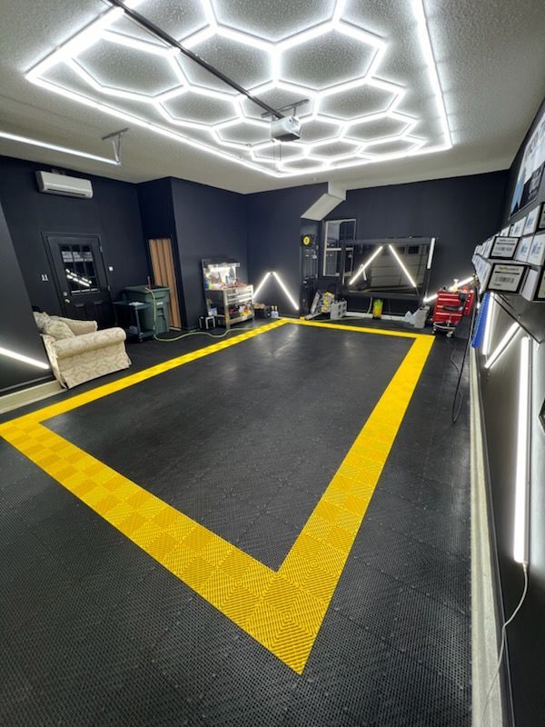A garage with a yellow line on the floor