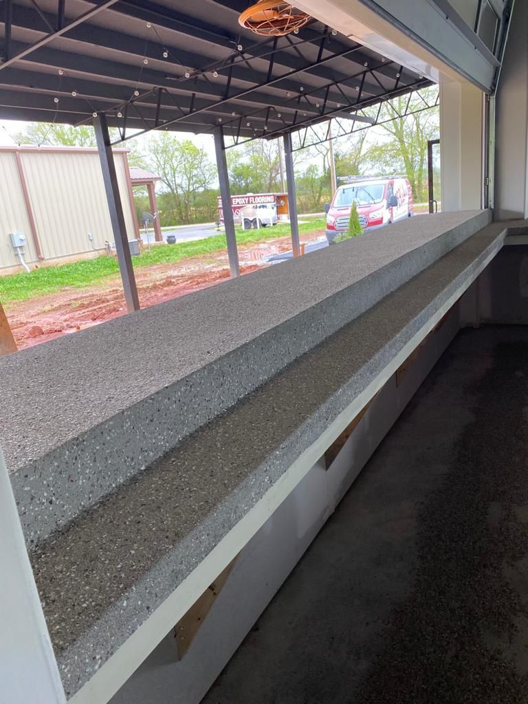 A large window with a view of a parking lot