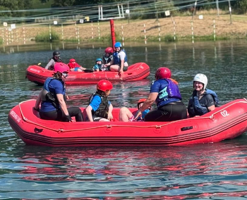 A team of women in a red raft
