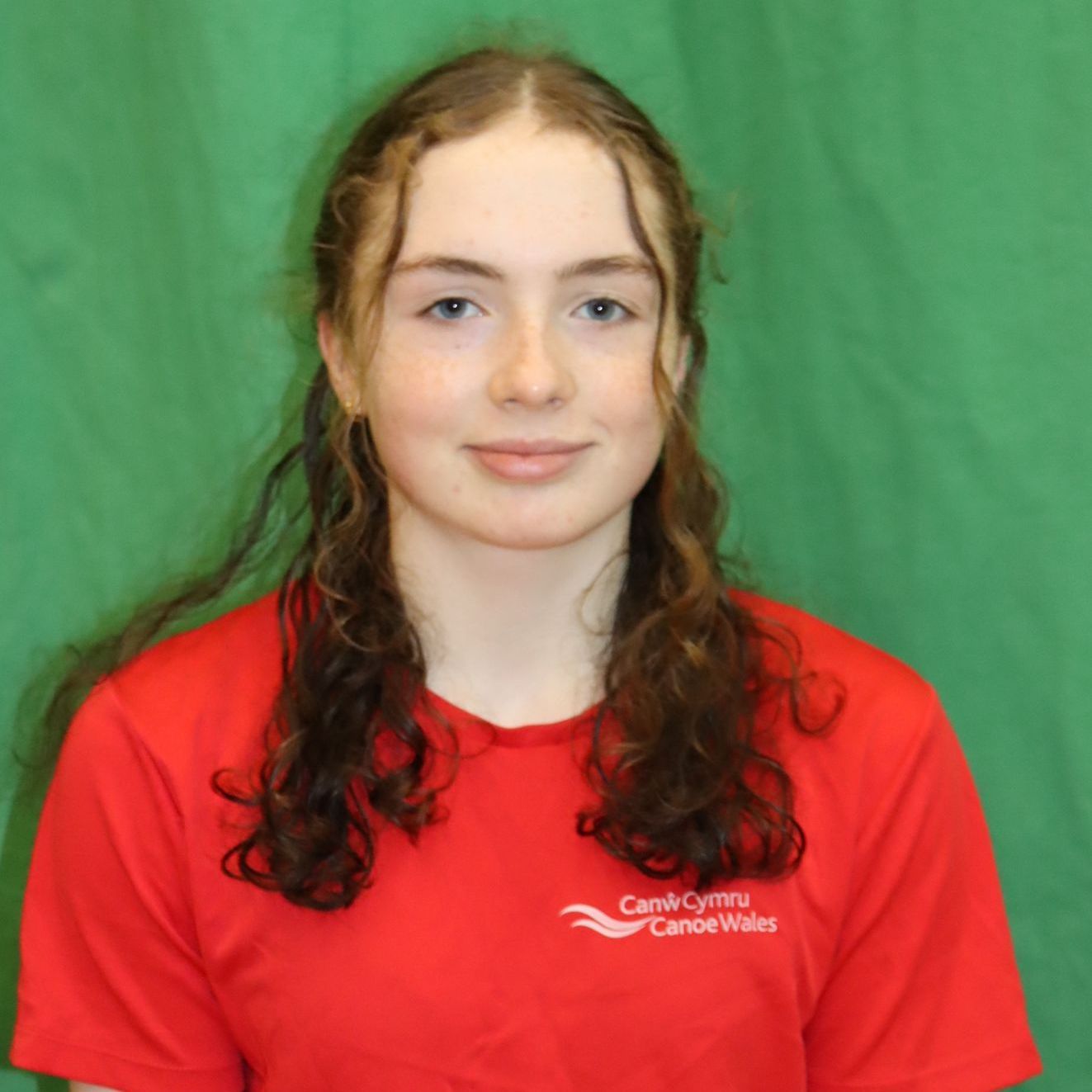 A young woman wearing a red canoe wales shirt