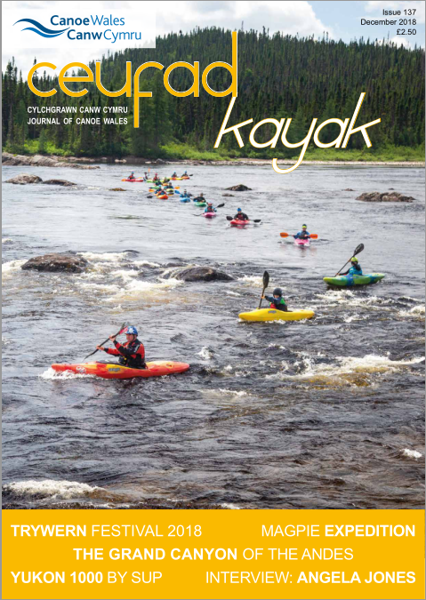 A magazine cover with people in kayaks on it