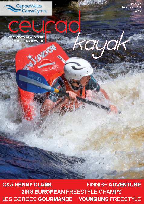 A magazine cover with a person in a kayak on it