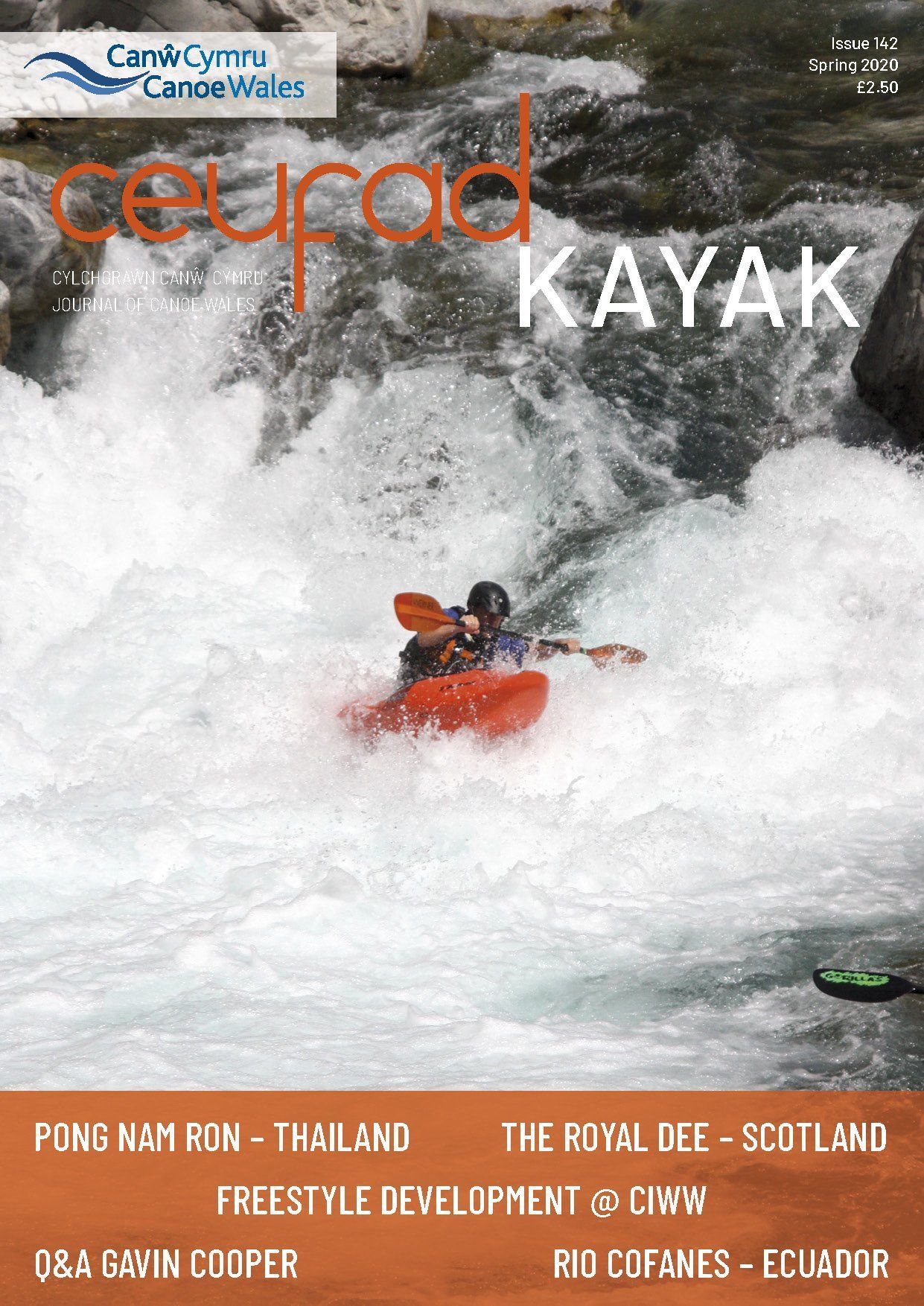 A magazine cover with a person in a kayak on it