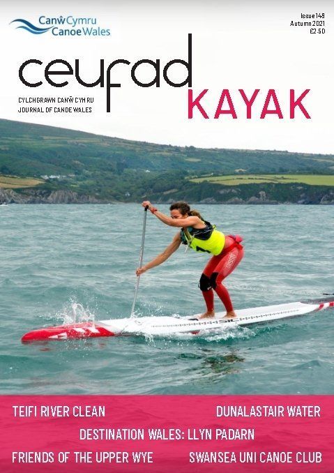 A woman is riding a kayak on the cover of a magazine