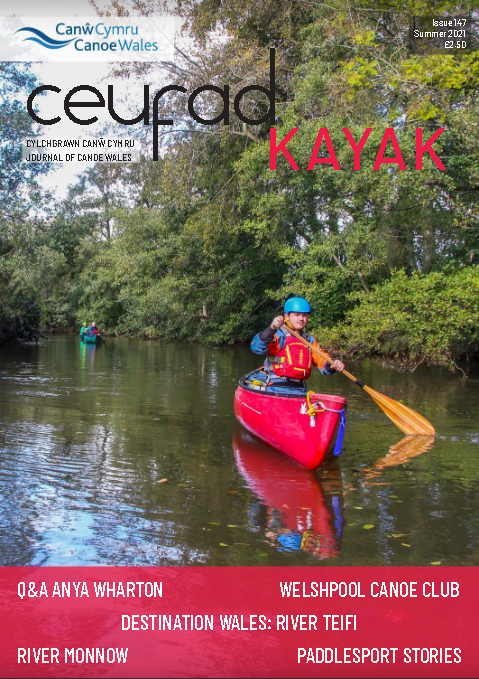 A person in a red kayak on the cover of a magazine