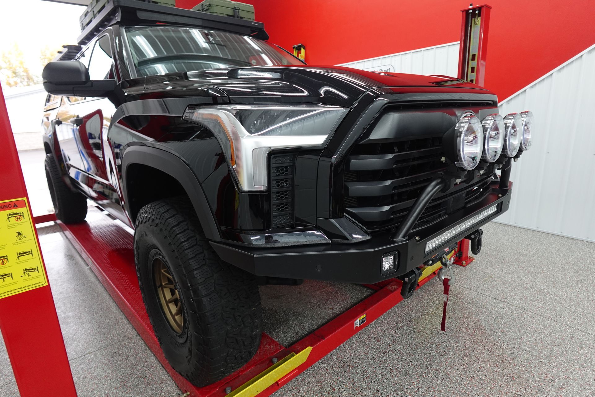 A close up of water drops on the hood of a car