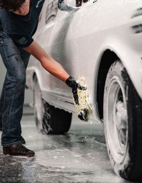 A close up of a car wheel with a mercedes logo on it