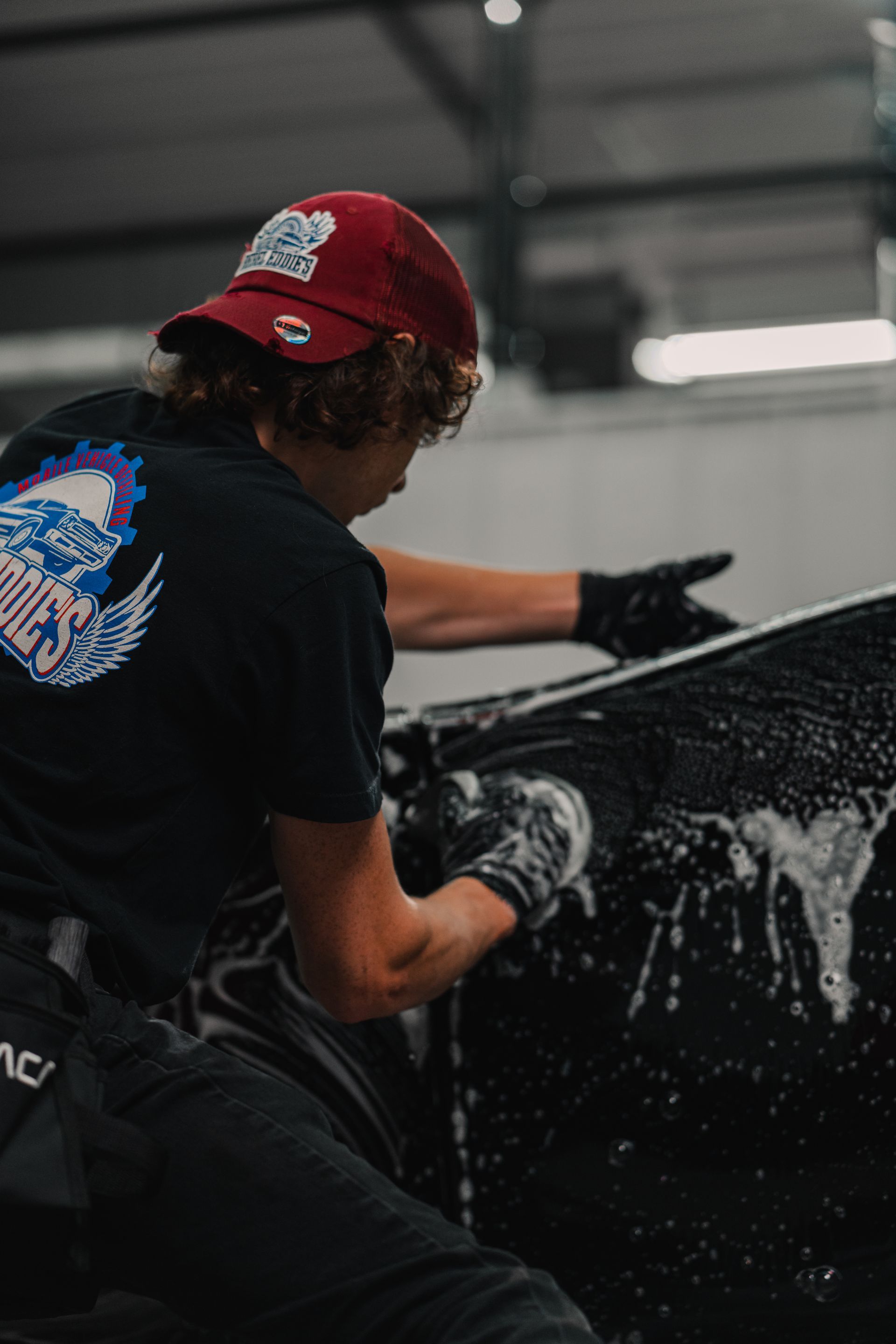 A yellow sports car is parked in a garage.
