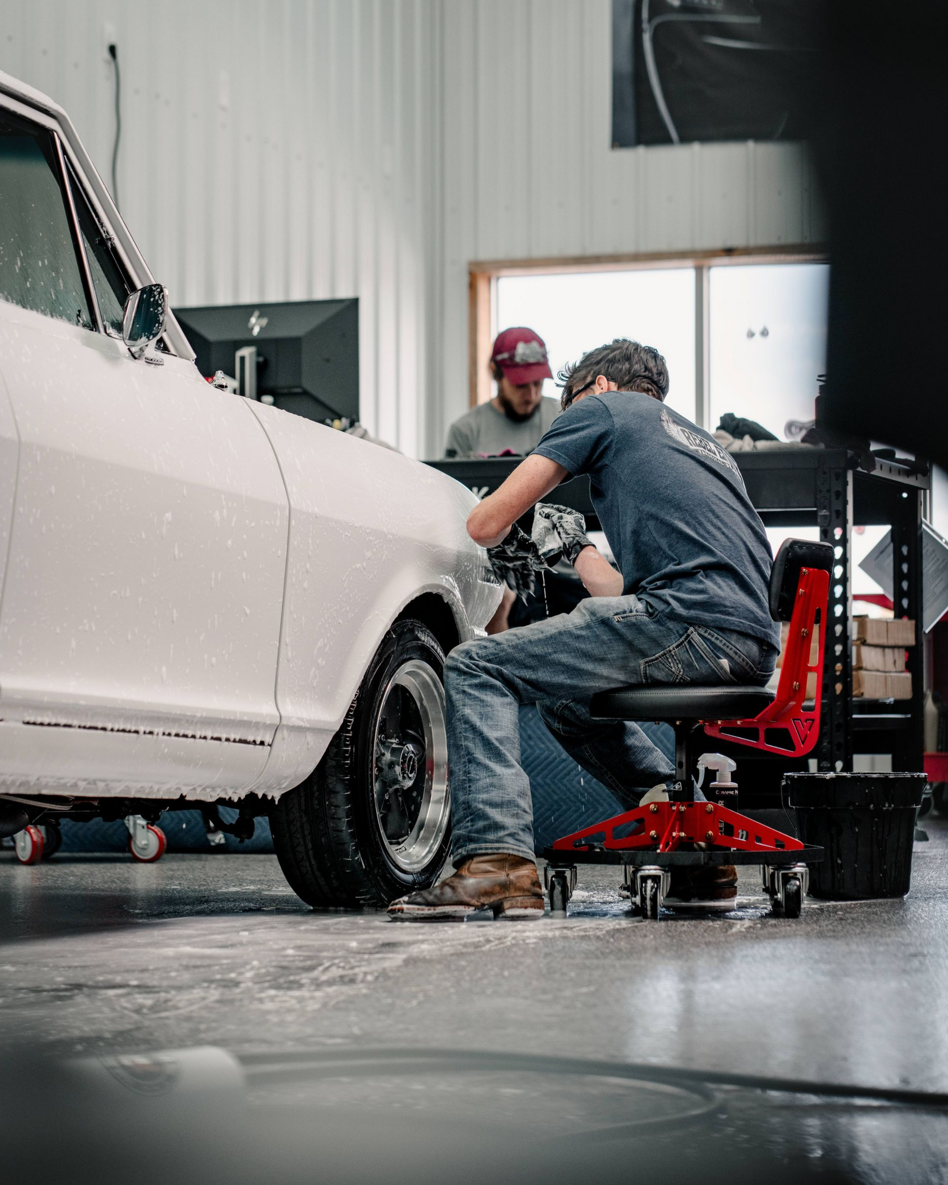 A man is holding a piece of glass with a picture of a cat on it