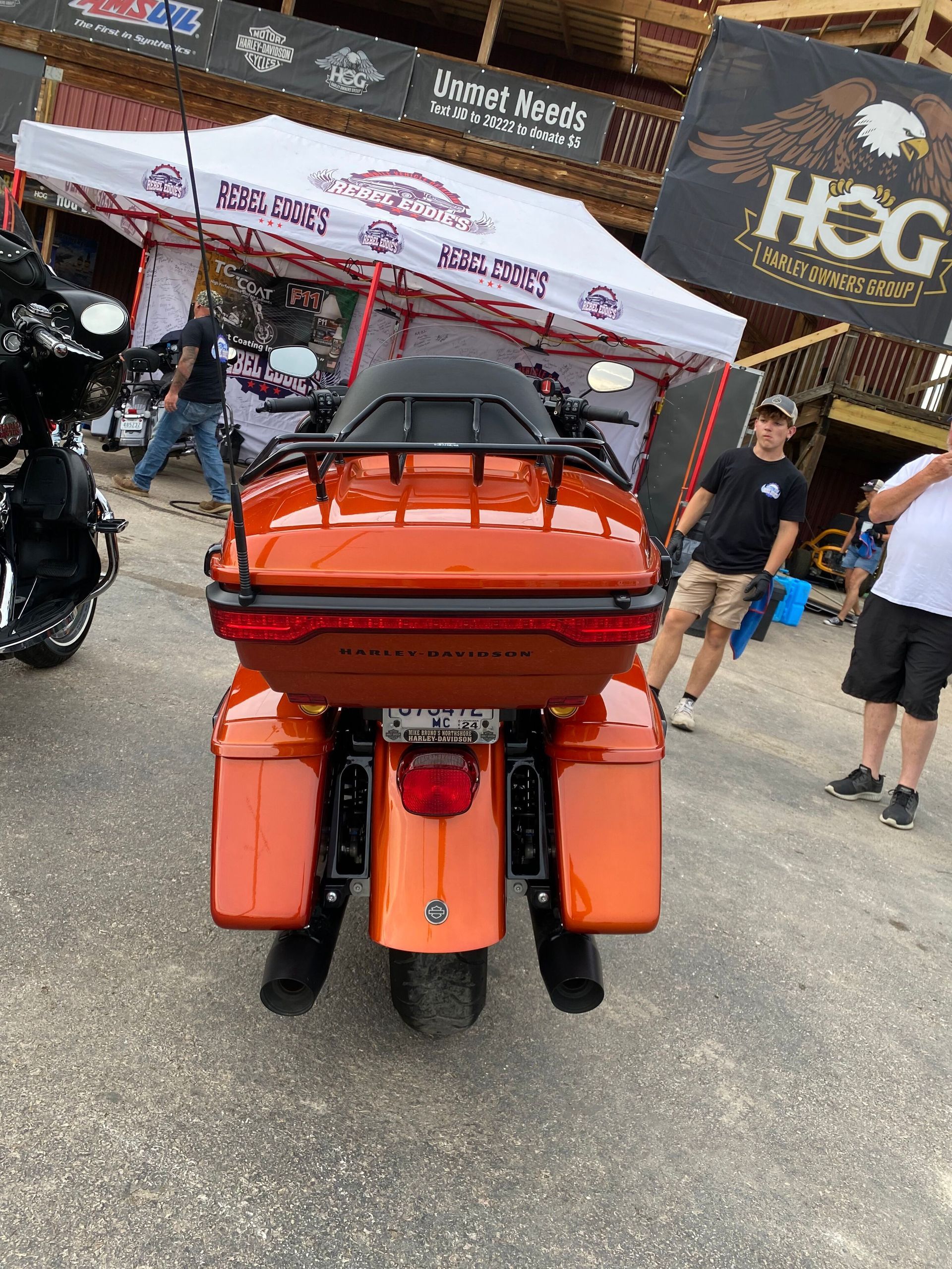 A yellow sports car is parked in a garage.