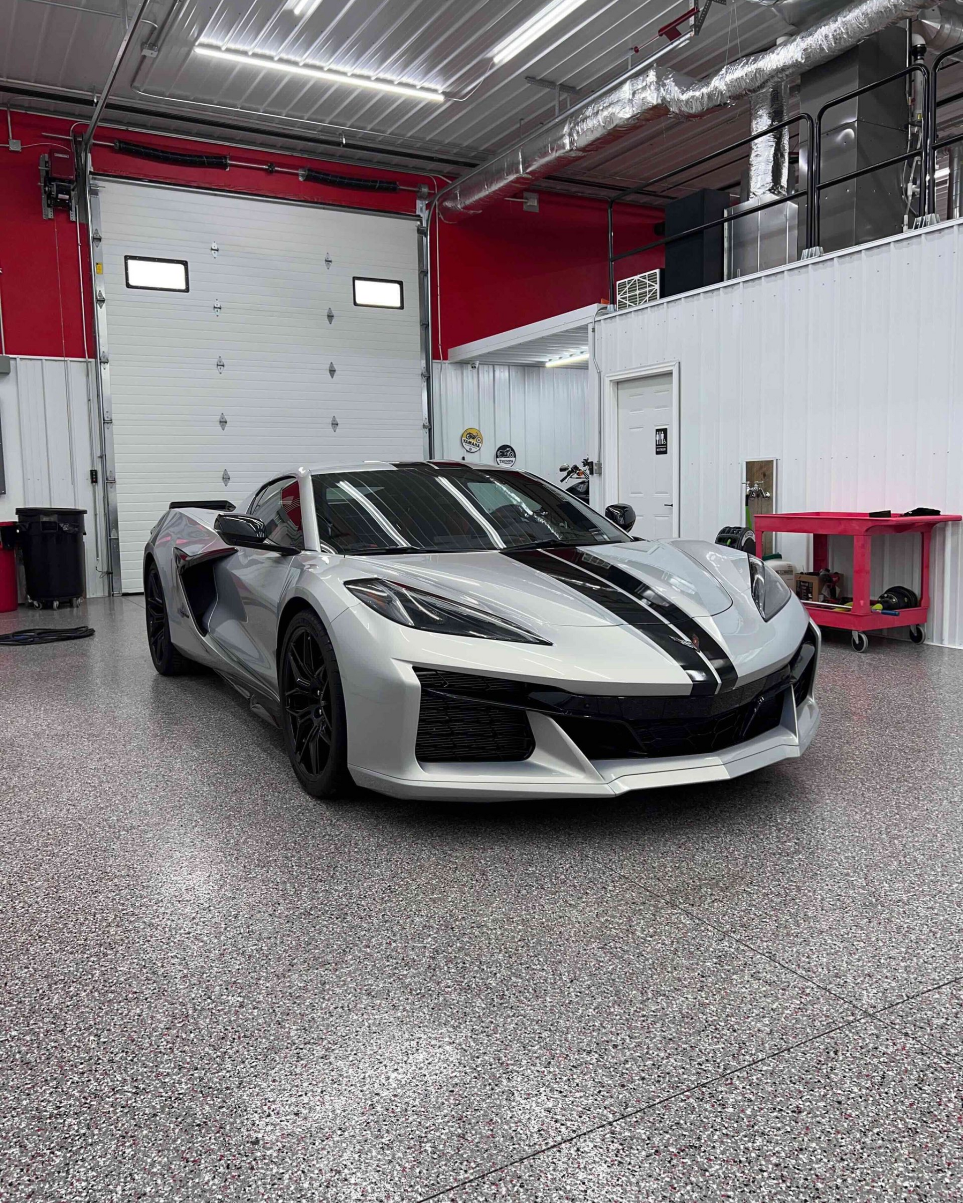 A close up of water drops on the hood of a car