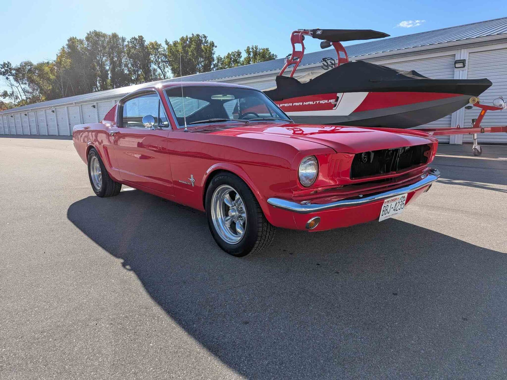 A close up of water drops on the hood of a car