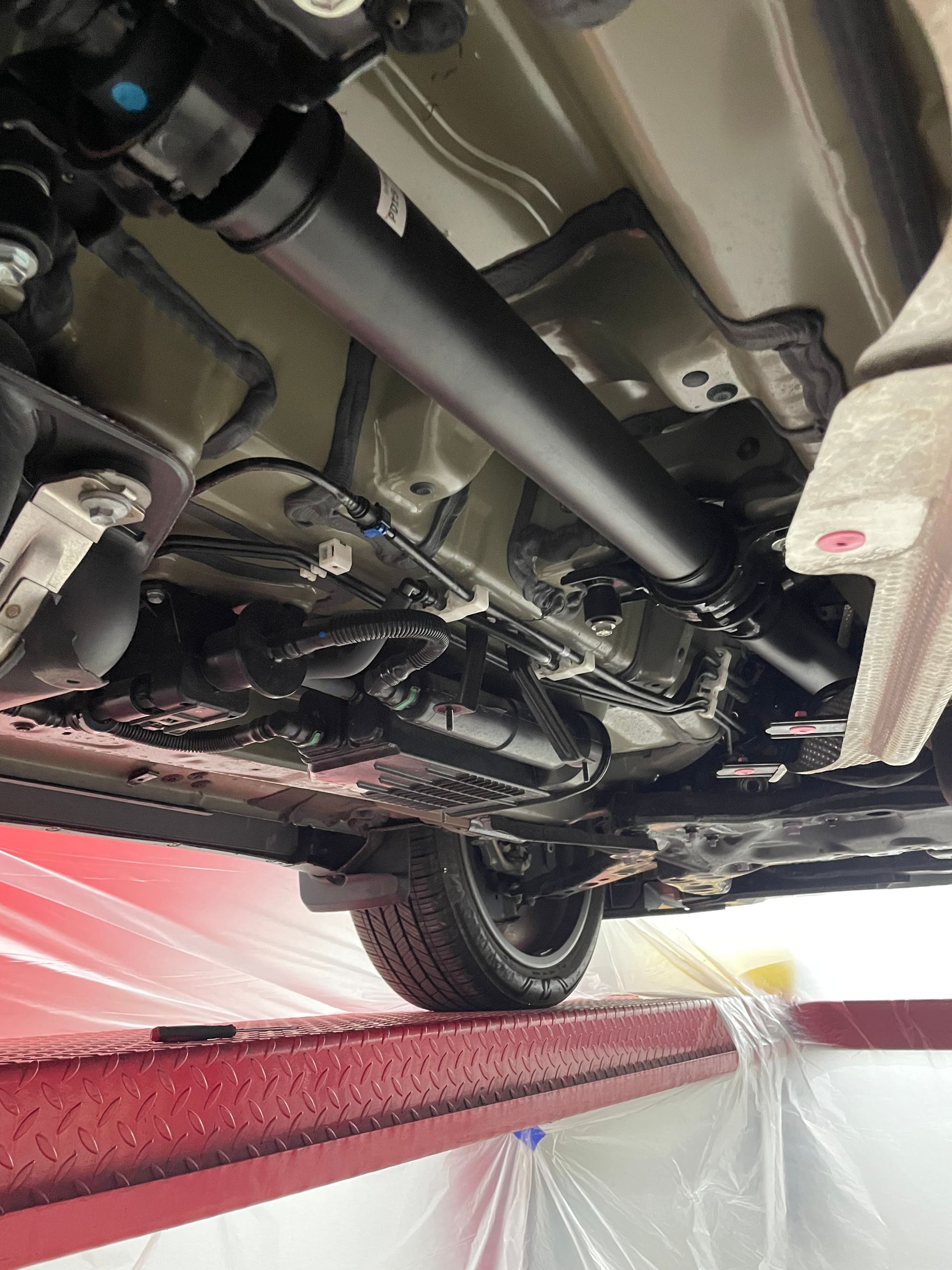 A close up of water drops on the hood of a car