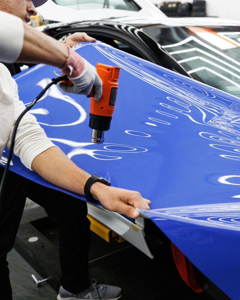 A close up of a car wheel with a mercedes logo on it