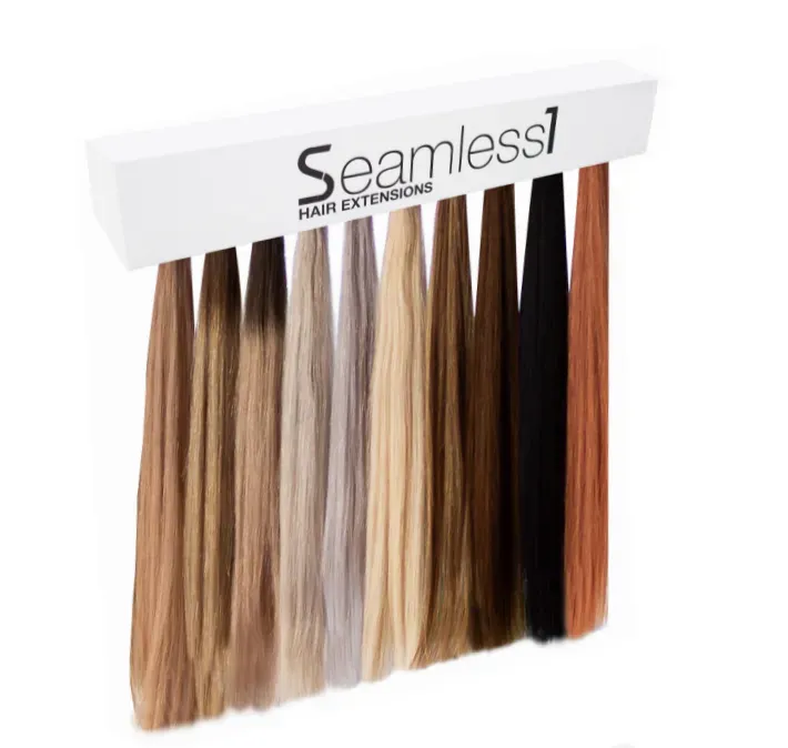 Hair extension color swatches hanging on a white display, various shades.