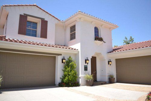 Garage Door Installation — White House with Brown Garage Door in Signal Hill, CA Garage Door Installation — White House with Brown Garage Door in Signal Hill, CA