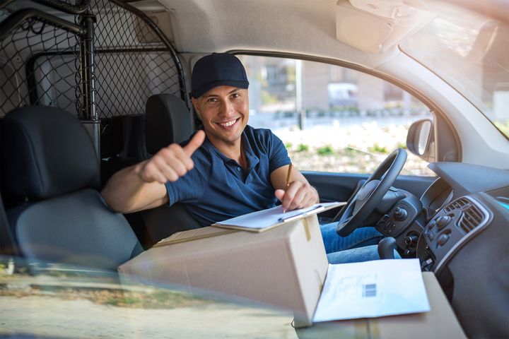 Happy Delivery Man Doing a Thumbs Up