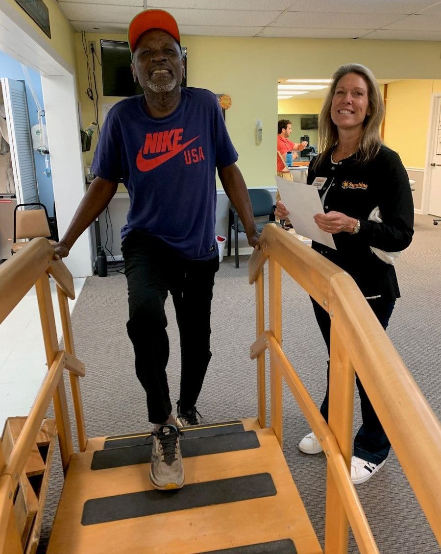A man wearing a nike shirt is walking down stairs