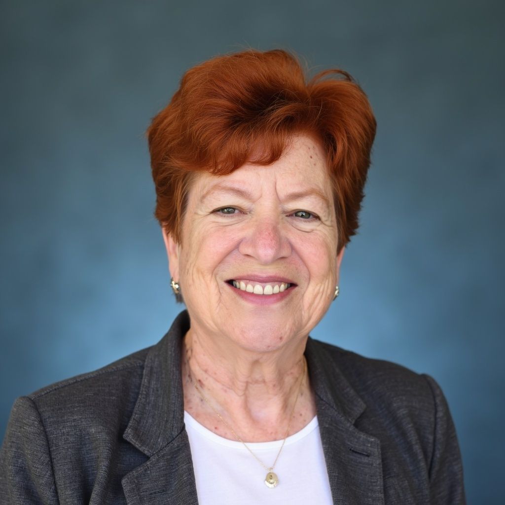 A bald man with a beard wearing a suit and white shirt