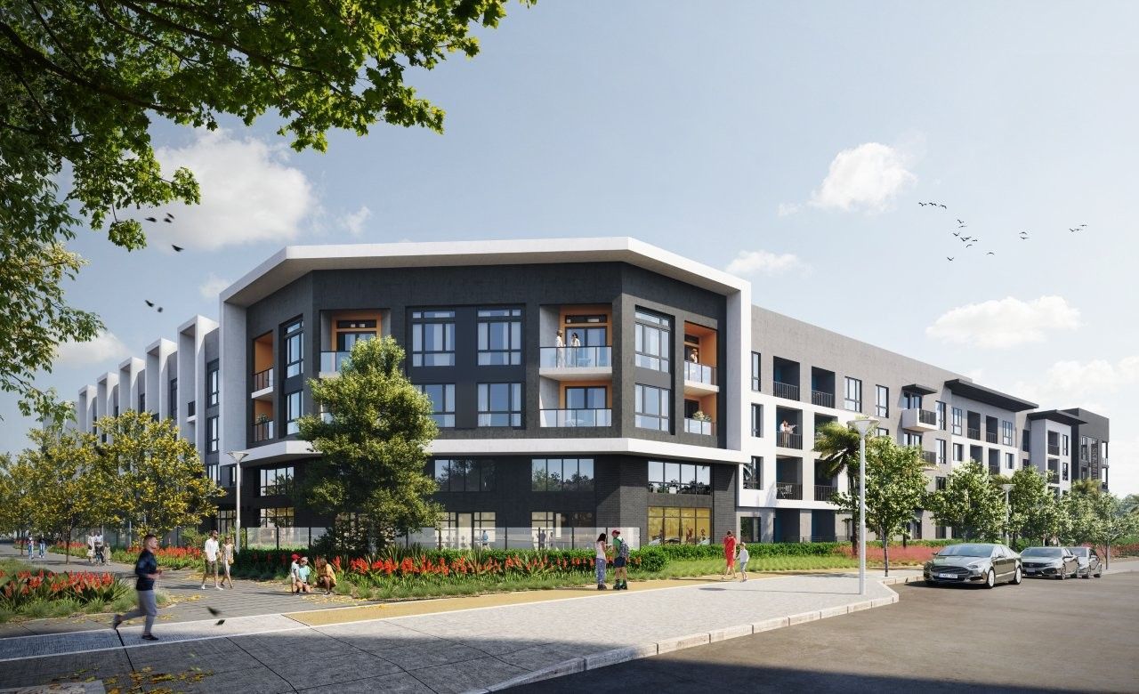 Modern apartment building with dark and white exterior. People walking on sidewalk. Sunny day.
