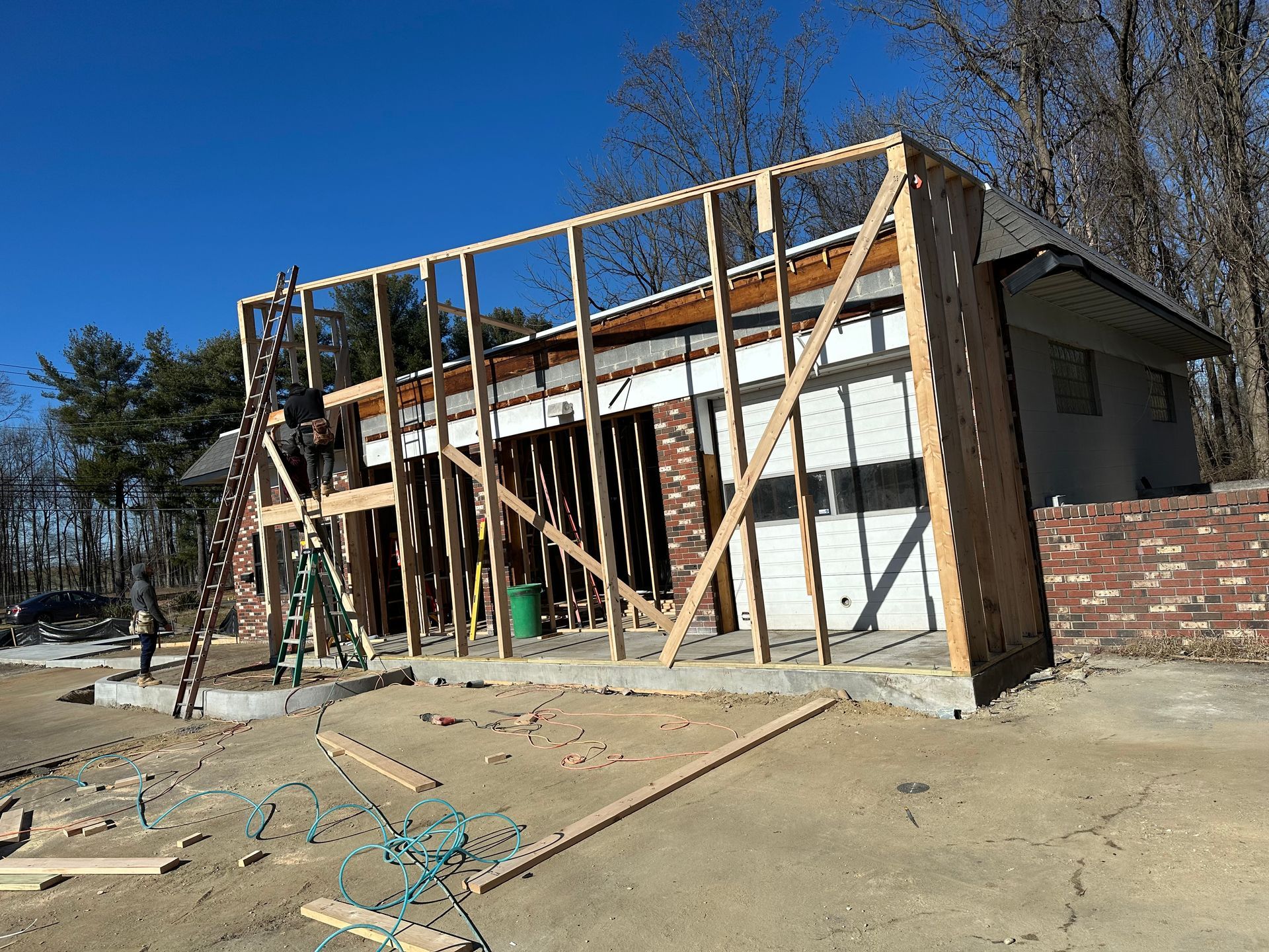 A house that is being built with a lot of wood