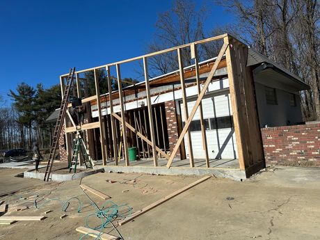 A house that is being built with a lot of wood