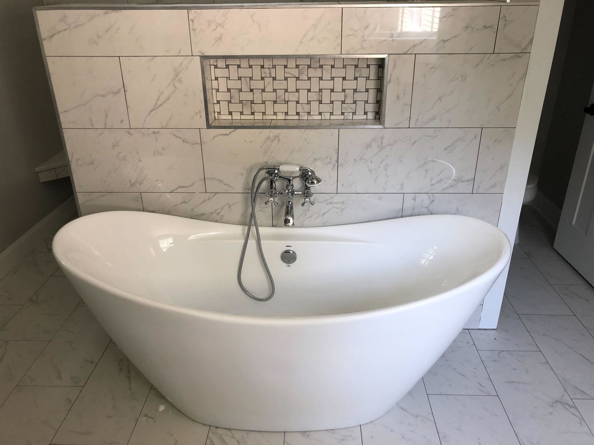 A large kitchen with white cabinets and granite counter tops.